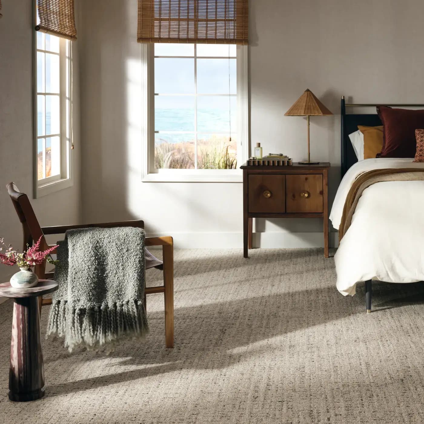 Taupe carpet in a cozy bedroom with bright light | FloorCo.