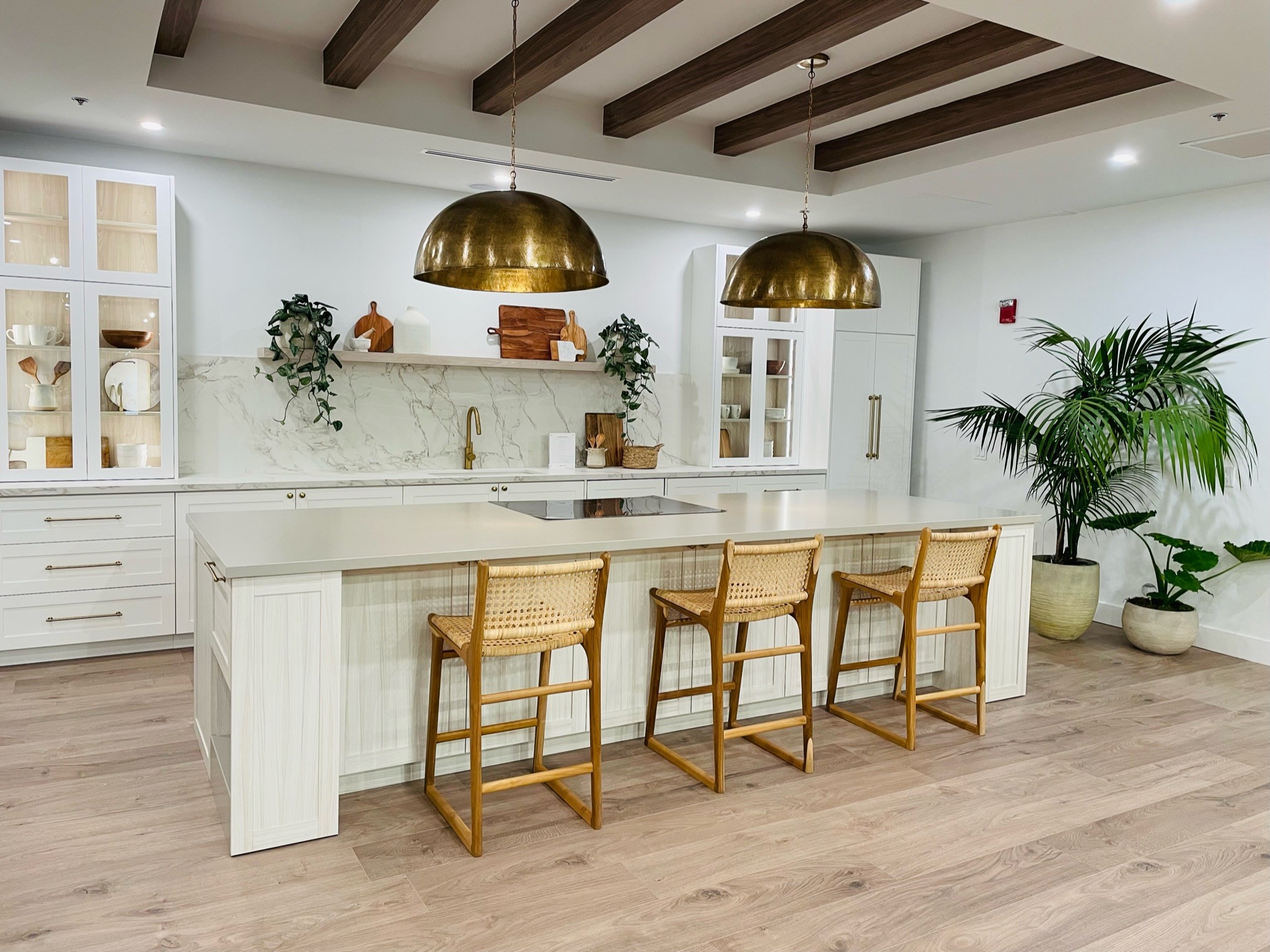 Laminate Flooring finishes in a large living room space basement by FloorCo Premium