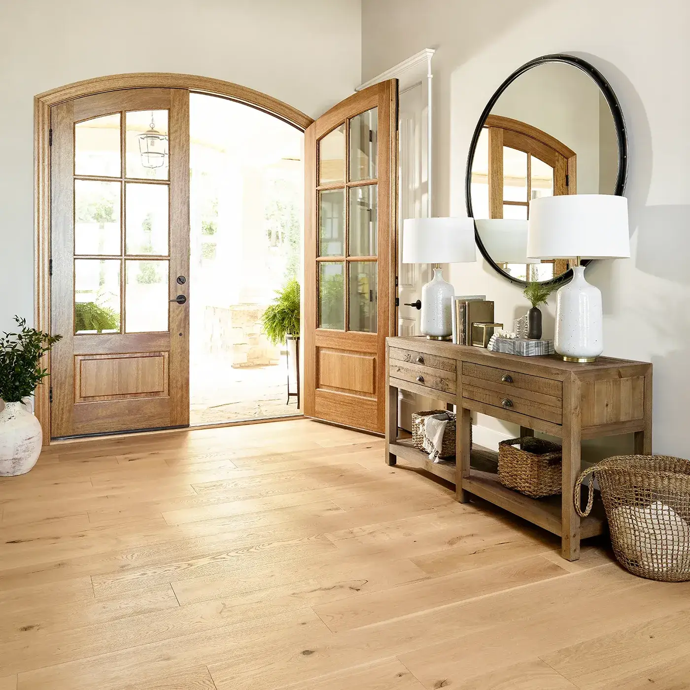 Shaw Floors light hardwood in an entryway with large wooden double doors | FloorCo.