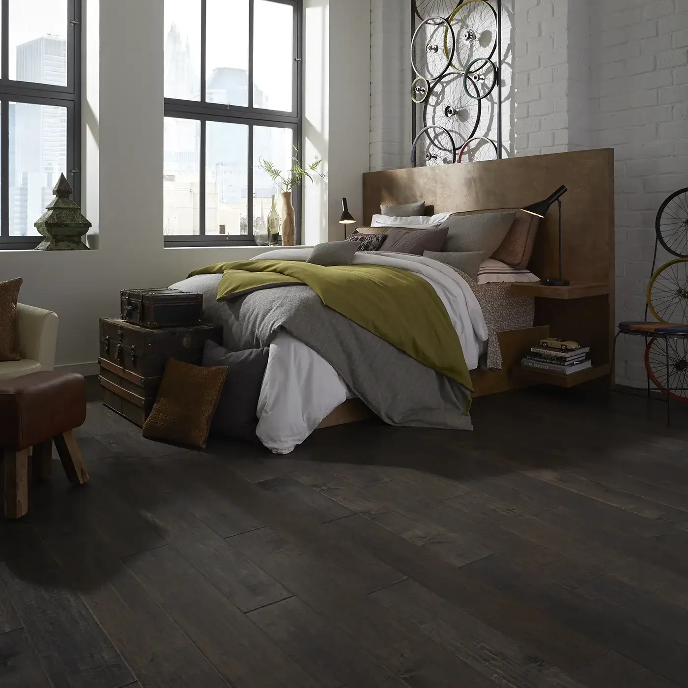 Dark hardwood in a modern bedroom with a large bed | FloorCo.