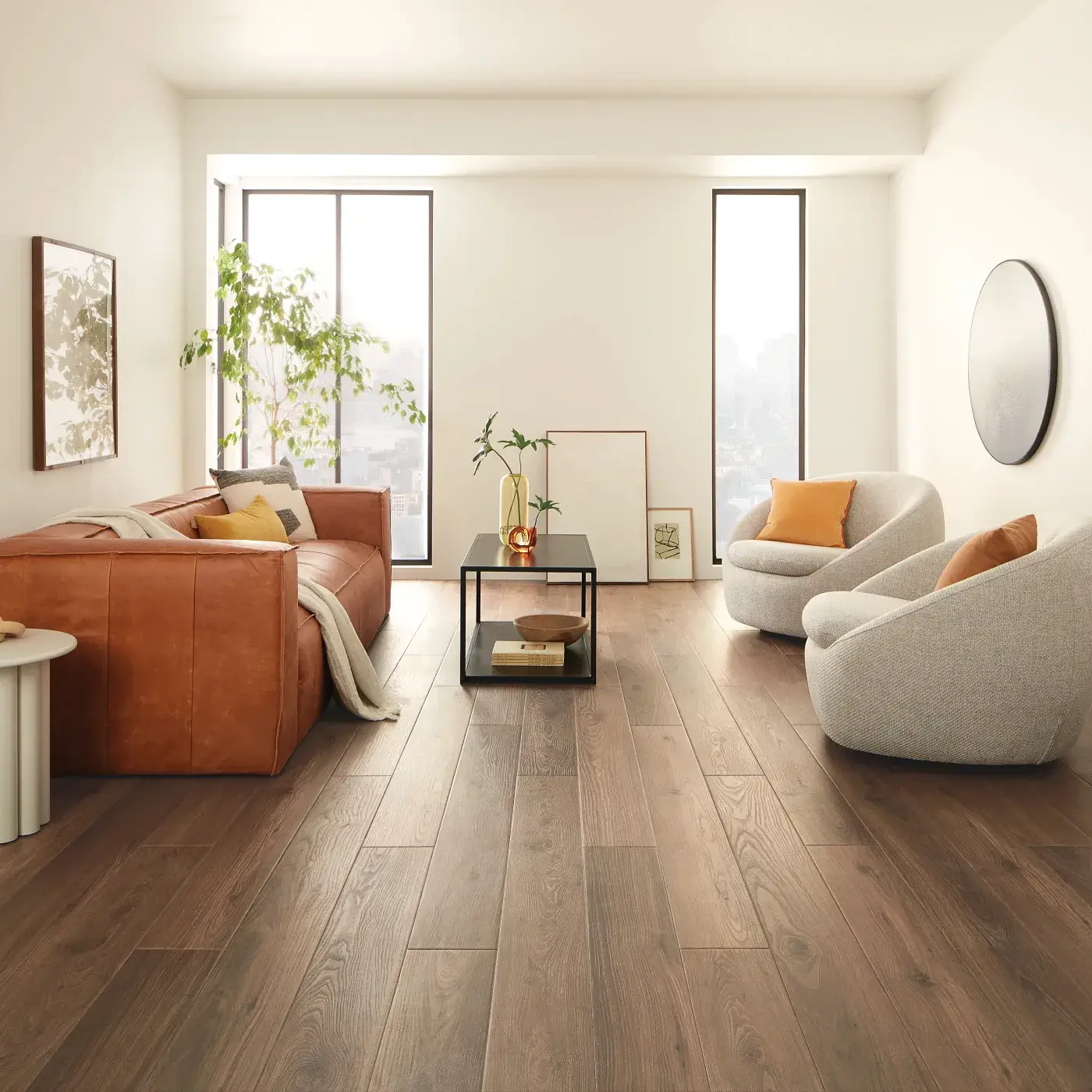 COREtec Luxury Vinyl in a dark brown wood tone in a bright living room | FloorCo.