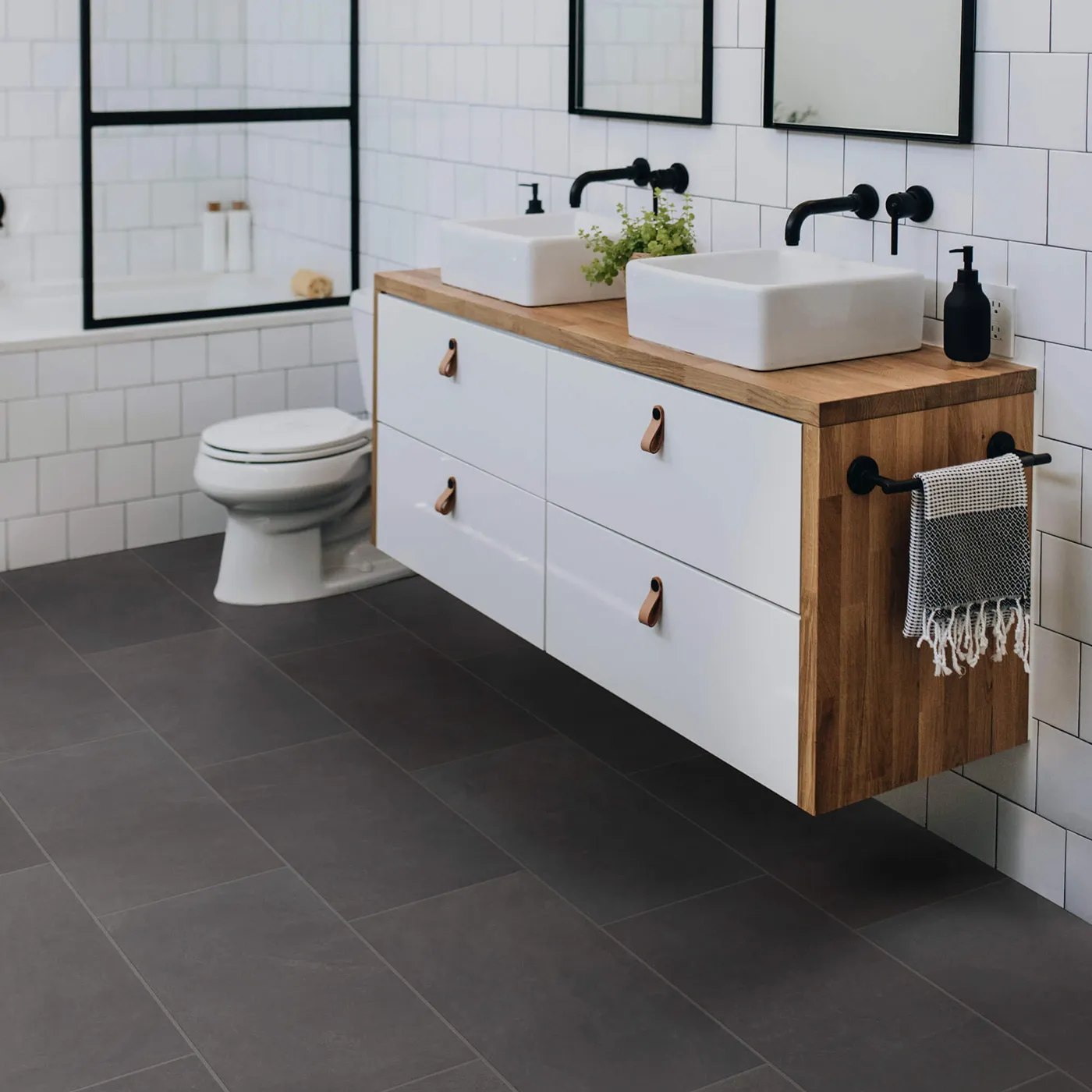 Shaw Floors Ember dark gray rectangular tile in a modern bathroom | FloorCo.