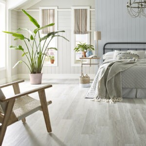 light-colored wood-look vinyl flooring in bedroom | Floorco Premium