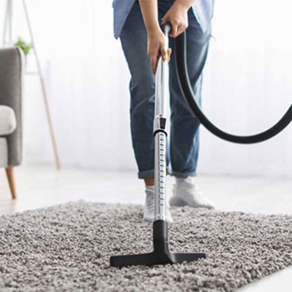 Person vacuuming area rug | Floorco Premium